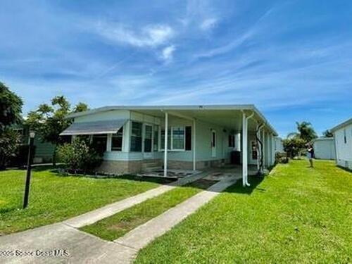 911 Oriole Circle, Barefoot Bay, FL 32976